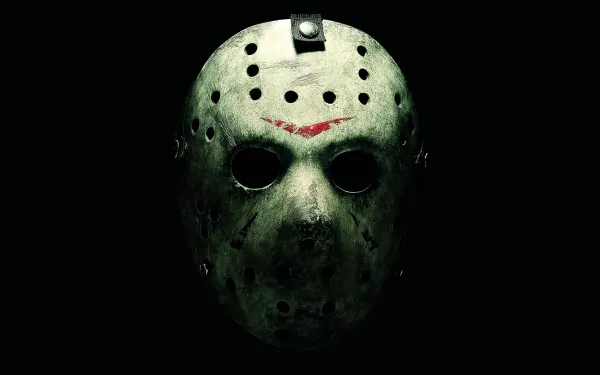 A haunting HD wallpaper featuring the iconic mask from *Friday the 13th* (2009), capturing the chilling essence of the horror movie's antagonist.