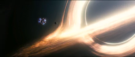 HD desktop wallpaper from the movie Interstellar featuring a vivid depiction of a black hole, showcasing stunning cosmic visuals and bright, swirling light.