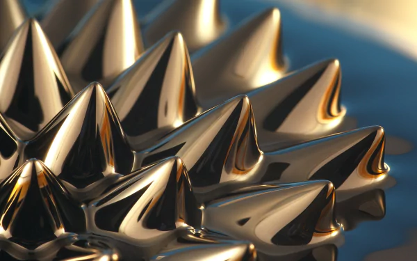 HD desktop wallpaper featuring a fluid, golden spiky structure with a smooth, reflective surface and a deep blue background.