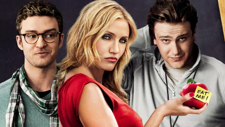 HD desktop wallpaper featuring Jason Segel, Cameron Diaz, and Justin Timberlake from the movie Bad Teacher, with Diaz holding an apple labeled Eat Me.