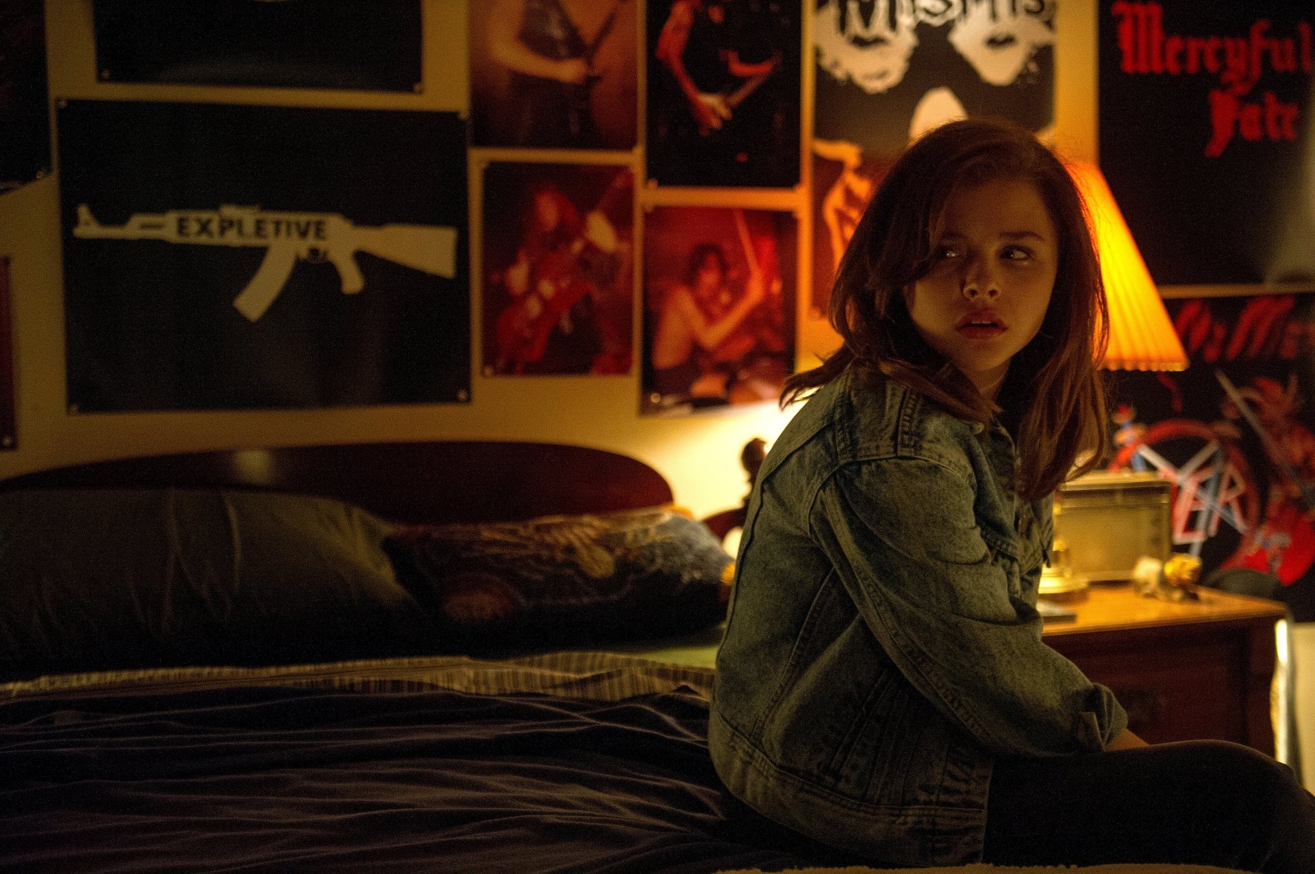 Chloë Grace Moretz in a dimly lit room from the movie Dark Places, featured in a 4K Ultra HD PC desktop wallpaper and background.