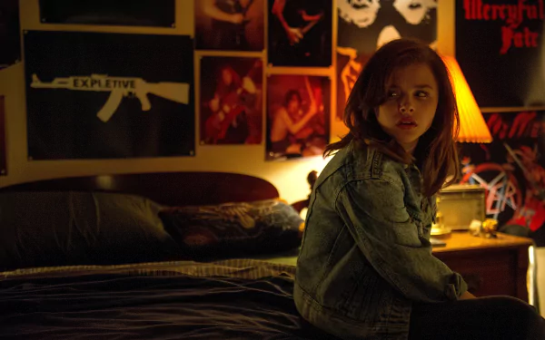 Chloë Grace Moretz in a dimly lit room from the movie Dark Places, featured in a 4K Ultra HD PC desktop wallpaper and background.