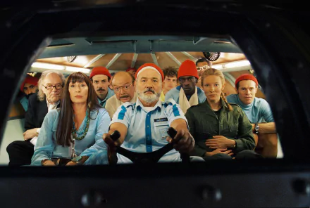 Cast of The Life Aquatic with Steve Zissou, including Cate Blanchett and Bill Murray, seated together in a colorful underwater expedition scene, 4K Ultra HD wallpaper.