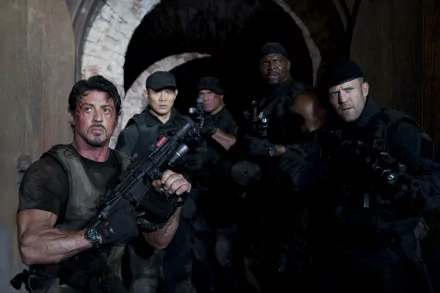 Action-packed HD wallpaper featuring characters from The Expendables, including Barney Ross (Sylvester Stallone), Lee Christmas (Jason Statham), and Hale Caesar (Terry Crews) armed and ready.