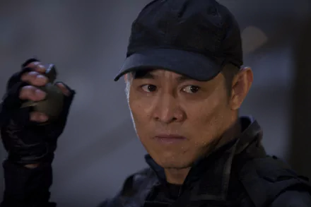 Jet Li as Yin Yang in The Expendables, set against a dramatic background. This 4K Ultra HD desktop wallpaper showcases his intense expression and action-ready stance.