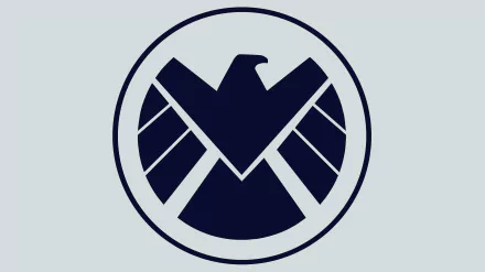 A bold depiction of the S.H.I.E.L.D. logo, featuring a stylized eagle emblem within a circular design, presented as a striking 4K Ultra HD wallpaper for desktop backgrounds.