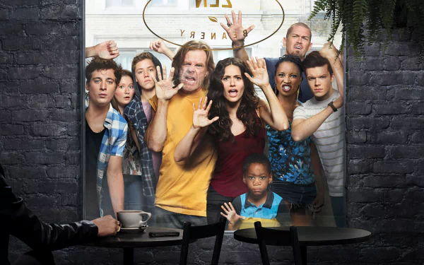A vibrant HD wallpaper featuring the cast of the TV show Shameless, showcasing their expressive faces and dynamic energy against an urban backdrop.
