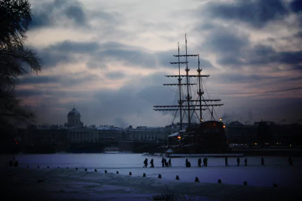 A man-made ship docked along the waterfront in Saint Petersburg under a cloudy sky, captured in stunning 4K Ultra HD detail.