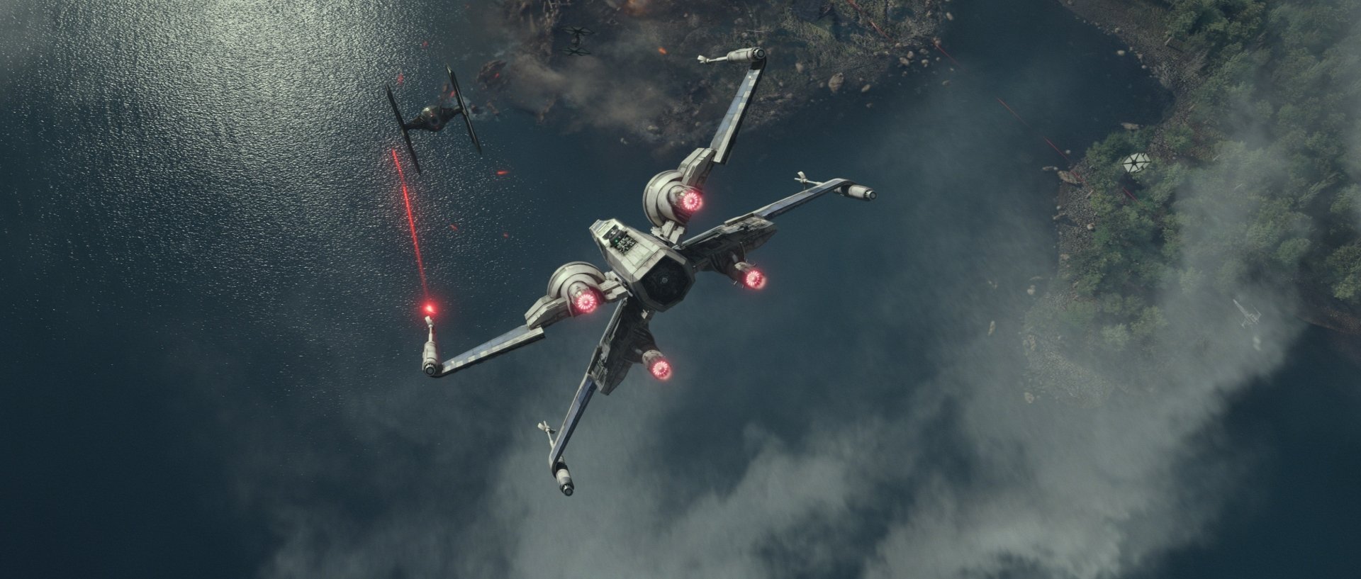 An X-Wing maneuvers in battle against a TIE Fighter over a dramatic landscape, capturing the excitement of Star Wars Episode VII: The Force Awakens in this HD desktop wallpaper.