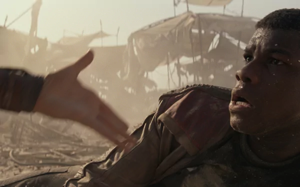 Finn, portrayed by John Boyega in Star Wars Episode VII: The Force Awakens, reaches out amid a dusty, battle-worn landscape in this HD movie wallpaper.