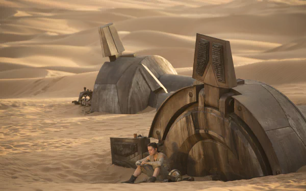 A stunning HD wallpaper from Star Wars: Episode VII - The Force Awakens, featuring Rey (Daisy Ridley) sitting among the remnants of a spacecraft in a desert landscape.