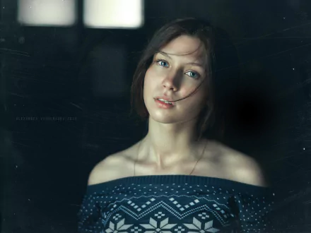 HD desktop wallpaper featuring a close-up portrait of a woman model with soft lighting and a dark, blurred background.