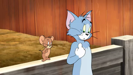 HD wallpaper and background featuring Tom and Jerry from the TV show, with Tom looking surprised and Jerry standing behind him against a wooden backdrop.