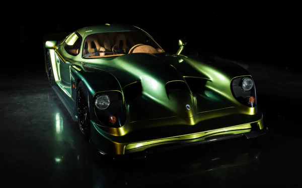 A sleek green Panoz Esperante sports car showcased against a dark background, captured in high definition as a striking PC desktop wallpaper.