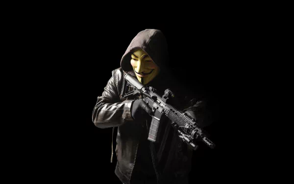 HD desktop wallpaper featuring an anonymous figure in a Guy Fawkes mask, wearing a dark hood and jacket, holding a rifle against a black background. Technology and anonymity themes are prominent.
