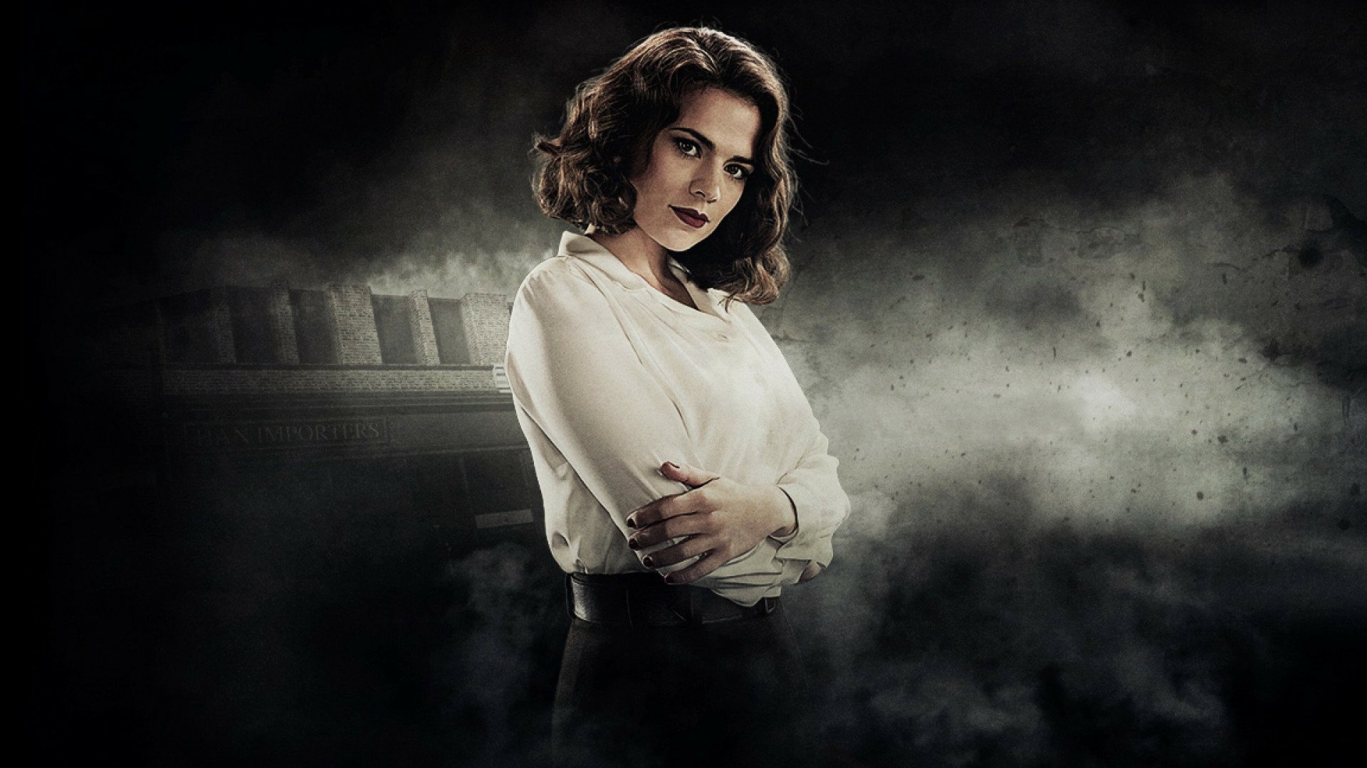 HD PC desktop wallpaper featuring a character from the movie Captain America: The First Avenger, set against a dark, smoky backdrop.