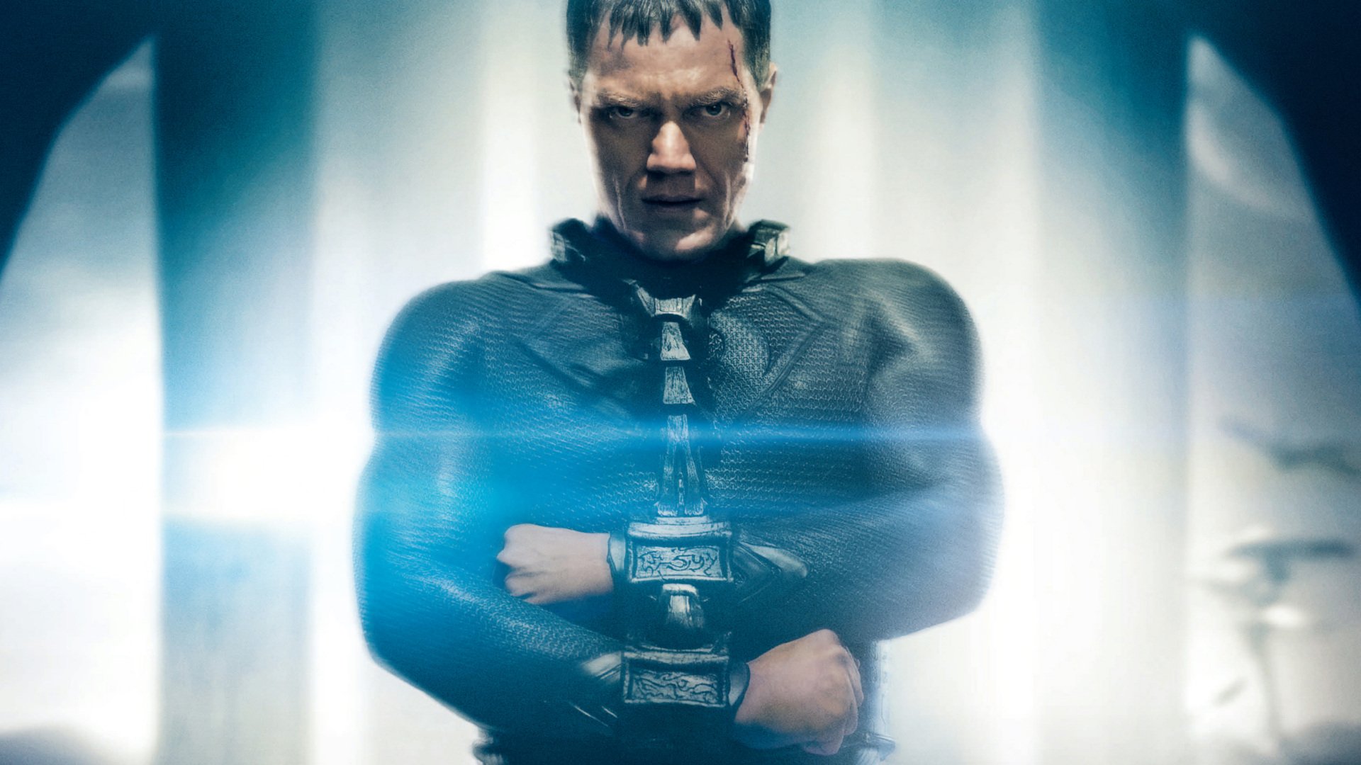 HD PC desktop wallpaper featuring a dramatic scene from the movie Man of Steel with a focused character in a dark costume and glowing blue light effects.