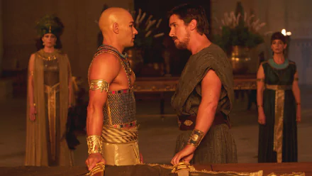 HD PC desktop wallpaper from the movie Exodus: Gods and Kings, featuring a tense confrontation between two central characters in ancient attire.