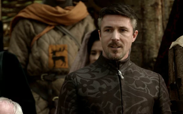 HD desktop wallpaper featuring Aidan Gillen as Petyr Baelish from the TV show Game of Thrones, set in a medieval outdoor scene.