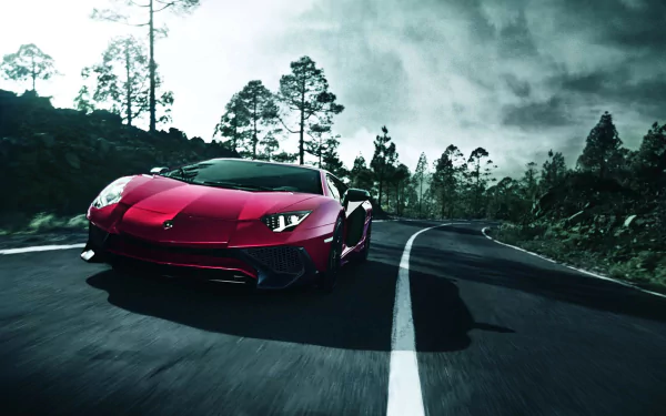A red Lamborghini Aventador SV supercar driving on a winding road surrounded by trees, captured in high definition as a striking PC desktop wallpaper.