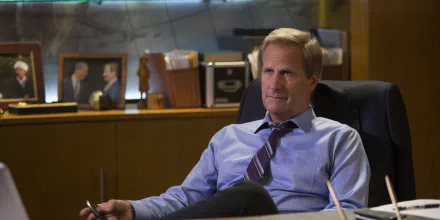 HD desktop wallpaper of a character from The Newsroom (2012) sitting pensively in an office setting.