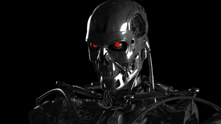 HD wallpaper featuring the T-800 from the movie The Terminator, showcasing its iconic metallic skull and glowing red eyes against a dark background.