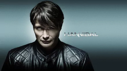 2K Quad HD PC desktop wallpaper for the Hannibal TV show: brooding man in a dark leather jacket against a cool teal gradient, center-lit with the HANNIBAL logo.