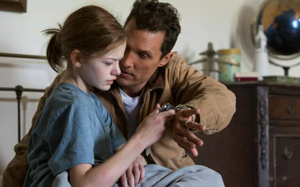 HD PC desktop wallpaper from the movie Interstellar, featuring a tender moment between a man and a young girl in a cozy, vintage-style room.