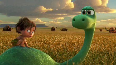 HD wallpaper from the movie The Good Dinosaur featuring a young boy and a green dinosaur in a field with cloudy skies and mountains in the background.