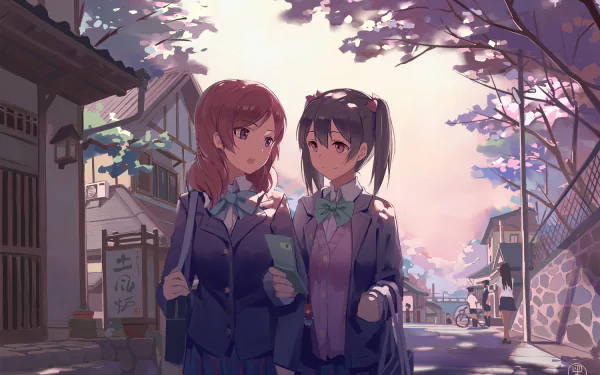 Maki Nishikino and Nico Yazawa stroll together under cherry blossoms, both in school uniforms, showcasing their vibrant personalities in this beautiful Love Live! anime scene.