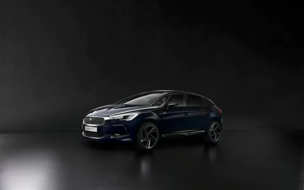 A sleek black Citroën DS5 car positioned against a dark background, showcasing the vehicle’s modern design in high definition.