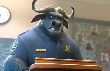 Chief Bogo from Zootopia stands confidently at a podium, wearing his police uniform, in this striking 4K Ultra HD desktop wallpaper and background.