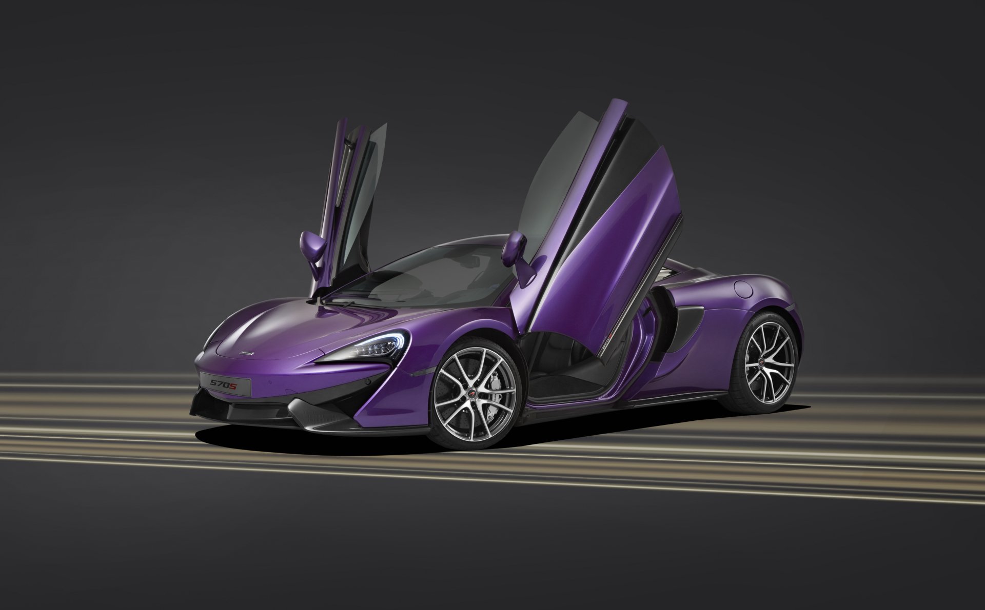 Purple McLaren 570S supercar with butterfly doors open, showcased as a 4K Ultra HD desktop wallpaper and background.