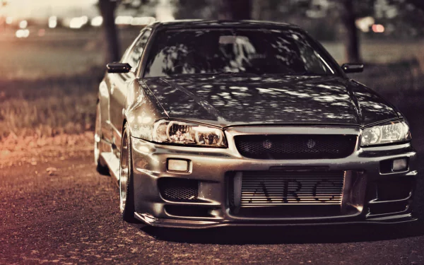 HD desktop wallpaper featuring a JDM car parked on a scenic roadway at dusk.