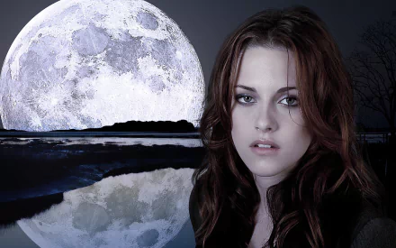 A stunning HD desktop wallpaper featuring actress Kristen Stewart, set against a serene night scene with a large moon reflecting on water.