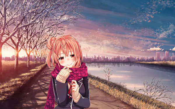 Yui Yuigahama from My Teen Romantic Comedy SNAFU smiles warmly while wrapped in a cozy scarf, set against a serene riverside sunset. A beautiful HD desktop wallpaper.