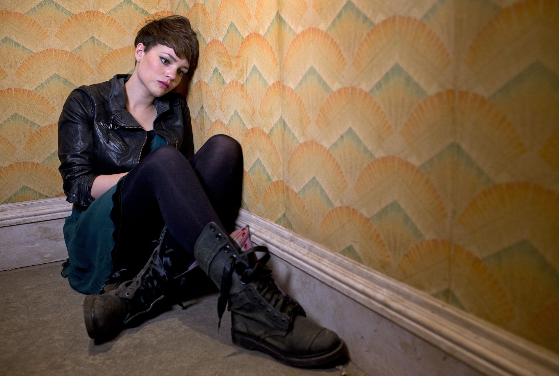 Alex Millar from the TV show Being Human sits against a patterned wall in this 4K Ultra HD desktop wallpaper and background.