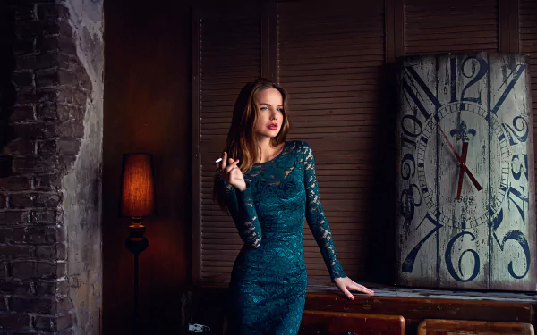 Brunette woman with blue eyes and red lipstick in a teal dress, smoking while standing in front of a large vintage clock. Background features dim lighting and a rustic atmosphere. HD desktop wallpaper.