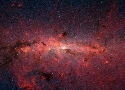 Infrared image of the Milky Way galaxy, featuring countless stars and cosmic formations. The HD wallpaper captures the vastness and beauty of space, creating a Sci-Fi inspired background.