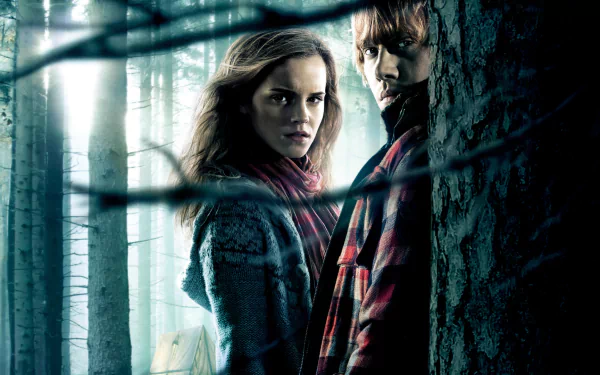 Rupert Grint as Ron Weasley and Emma Watson as Hermione Granger in a moody scene from Harry Potter and the Deathly Hallows: Part 1, set in a dark forest backdrop.