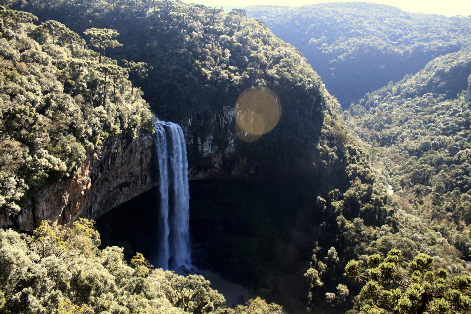 Caracol Falls plunging amid dense Brazilian forest, a nature scene in 4K Ultra HD PC desktop wallpaper and background.