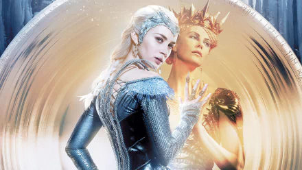 Emily Blunt and Charlize Theron star in a dramatic moment from The Huntsman: Winter's War, showcasing striking costumes against an ethereal backdrop. HD desktop wallpaper.