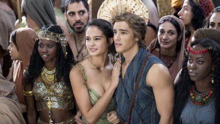 A scene from the movie *Gods of Egypt*, featuring characters amidst a crowd, showcasing rich costumes and a vibrant atmosphere. 4K Ultra HD wallpaper for PC desktops.