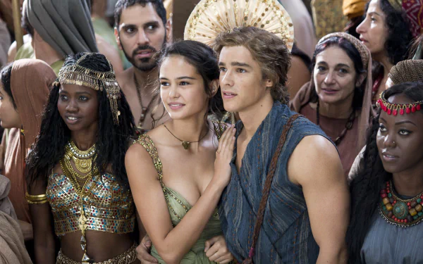 A scene from the movie *Gods of Egypt*, featuring characters amidst a crowd, showcasing rich costumes and a vibrant atmosphere. 4K Ultra HD wallpaper for PC desktops.