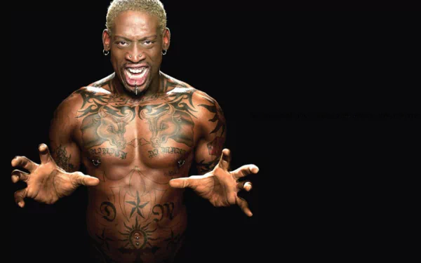 Dennis Rodman, a prominent basketball player, displays his tattoos and intense expression in this striking HD desktop wallpaper. A powerful representation of sports and personality.