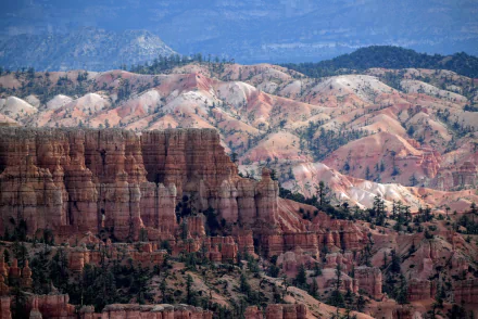 Majestic cliffs and colorful ridges of Bryce Canyon National Park in Utah showcase stunning natural beauty, framed by a serene landscape under a clear blue sky.