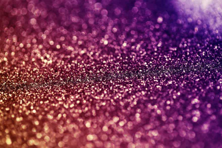 HD desktop wallpaper featuring a gradient of sparkling glitter from purple to gold.