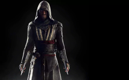 A striking HD desktop wallpaper featuring a hooded character from the movie Assassin's Creed, poised dramatically with weapons at the ready against a dark background.
