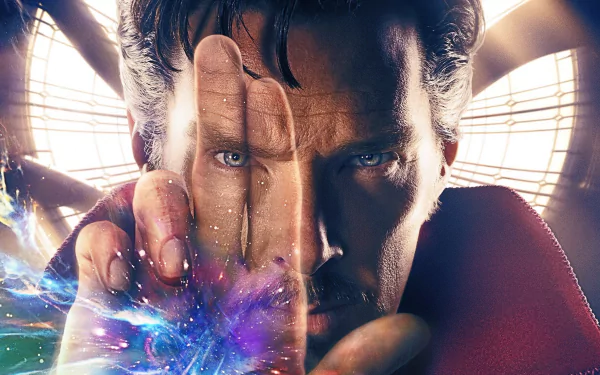 HD desktop wallpaper featuring Benedict Cumberbatch as Doctor Strange, showcasing his intense gaze and magical powers with vibrant visual effects in the background.