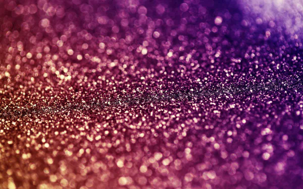 HD desktop wallpaper featuring a gradient of sparkling glitter from purple to gold.
